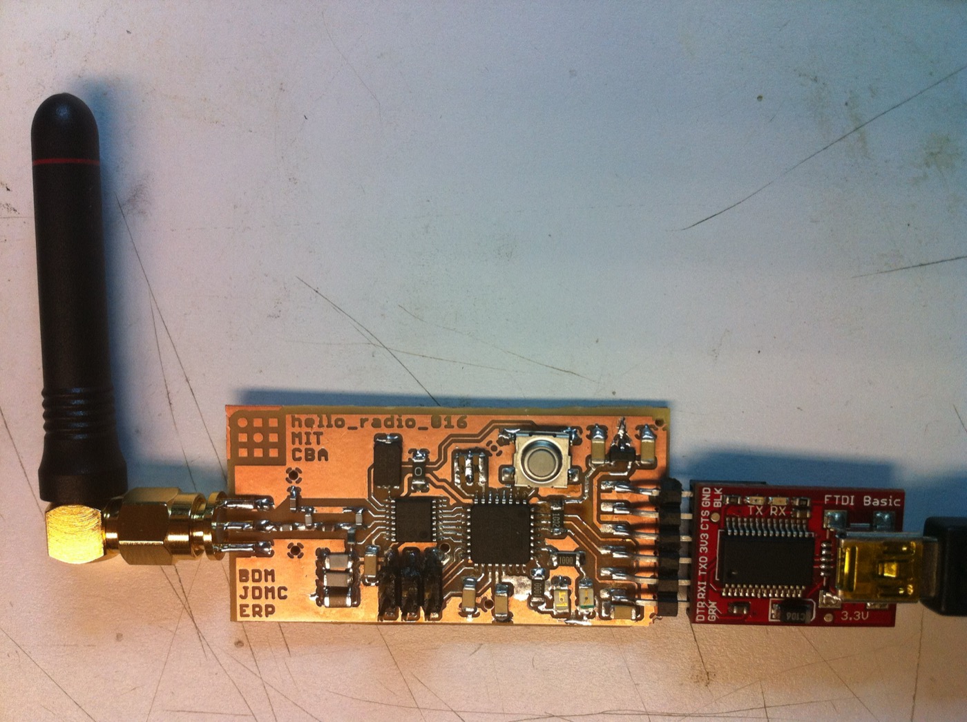 Revision 016 connected to an FTDI Basic USB-serial adapter — the radio's link to a host computer