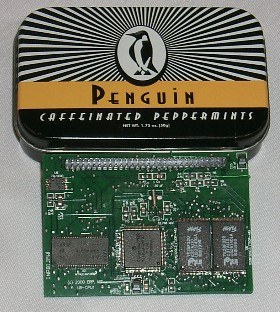 The processor core board next to a tin of Penguin caffeinated peppermints, for scale